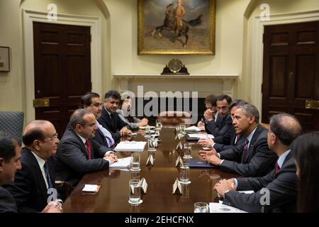 President Barack Obama drops by Deputy National Security Advisor Tony Blinken's meeting with Crown Prince Salman of Bahrain in the Roosevelt Room of the White House June 5, 2013. Stock Photo