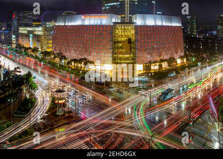 South Korea - JULY 2, 2018:From above of illuminated Lotte World Mall located near road with colorful lights in long exposure Stock Photo