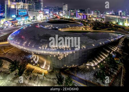 South Korea - JUNE 28, 2018:Glowing Dongdaemun Design Plaza with bronze figure landmarks in central district of Seoul and popular tourist destinations Stock Photo