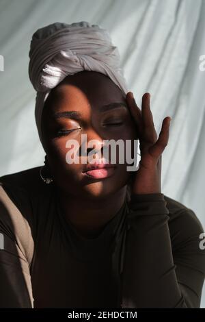 Overweight woman in black underwear pull up panties, back view. Flaunt  figure imperfections Stock Photo by burmistrovaiuliia