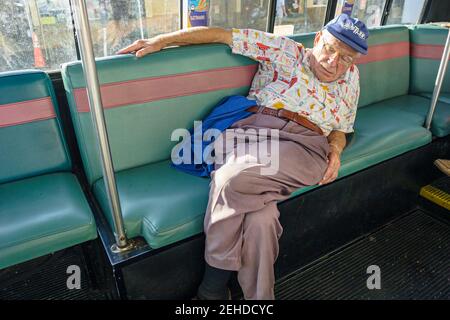 Miami Beach Florida,Washington Avenue Electrowave public bus,South Beach Local transportation sleeping senior elderly man rider passenger,