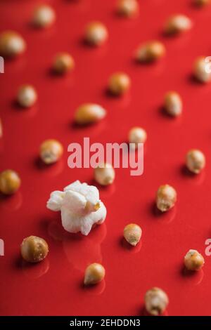 Closeup of some popcorn on a red background Stock Photo