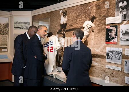 President Barack Obama tours the National Baseball Hall of Fame and Museum in Cooperstown, N.Y., May 22, 2014. Jeff Idelson, President of the Hall of Fame and Andre Dawson, 2010 Hall of Fame inductee, left, accompany him. Stock Photo