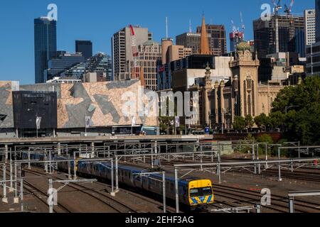 Railway tracks in front of the city skyline of Melbourne, Victoria, Australia. Stock Photo