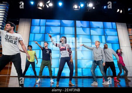 First Lady Michelle Obama rehearses with Ellen DeGeneres and the 'So You Think You Can Dance' dancers for a #GimmeFive 'Let's Move!' dance, prior to a taping of The Ellen DeGeneres Show in Burbank, Calif., March 12, 2015. Stock Photo