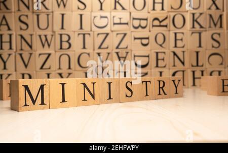 The word ministry is from wooden cubes. Economy state government terms. Stock Photo