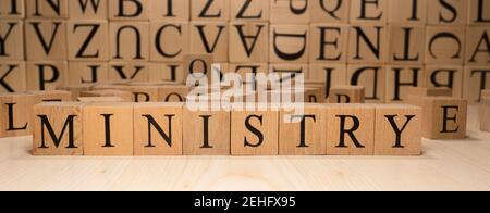 The word ministry is from wooden cubes. Economy state government terms. Stock Photo