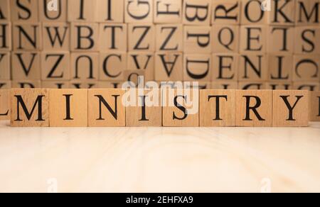 The word ministry is from wooden cubes. Economy state government terms. Stock Photo