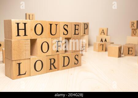 The word House of Lords is from wooden cubes. Economy state government terms. Background made of wooden letters. Stock Photo