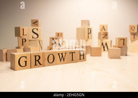 The word growth is from wooden cubes. Economy state government terms. Background made of wooden letters. Stock Photo