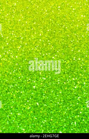 Abstract lime and emerald green and yellow glitter bokeh background. Festive backdrop for St. Patrick's Day, christmas, spring, holiday or event Stock Photo