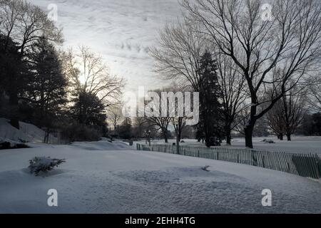 Life in a cold city - winterscapes from Ottawa - sunrise over Commissioners Park on a crisp, hazy winter's morning. Ontario, Canada. Stock Photo