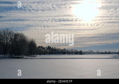 Life in a cold city - winterscapes from Ottawa - gorgeous sunrise over a frozen Dow's Lake. Ontario, Canada. Stock Photo