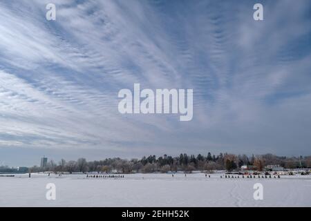 Life in a cold city - winterscapes from Ottawa - extraordinary cloud & blue sky over Dow's Lake in the morning. Ontario, Canada. Stock Photo