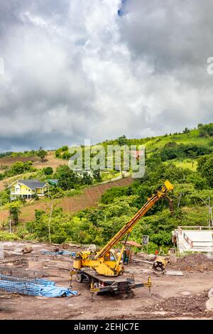 Truck crane standing on a construction site. Stock Photo