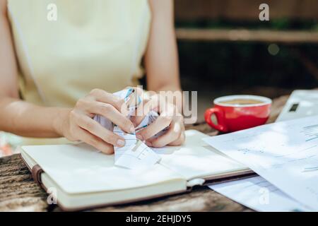 A businesswomen Crumpled up papers by hand. Fail, bad, no idea concept. Stock Photo