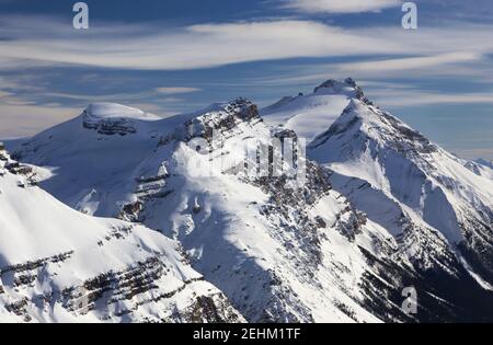 Aerial Landscape View Snow Covered Andromache and Hector Mountain Peaks. Cold Winter Day, Blue Skyline, Banff National Park, Canadian Rockies Stock Photo