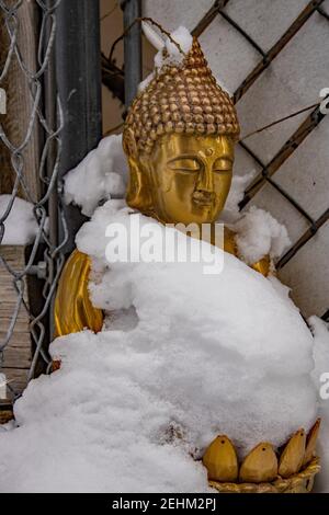 Snow covered Golden Buddha Stock Photo