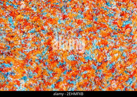 multicolored texture of wool carpet background. fragment colored carpets, bright wicker colorful rug Stock Photo