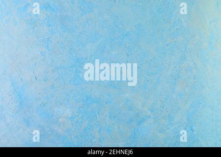 Background abstract texture of rough plaster with white splashes of blue. Stock Photo