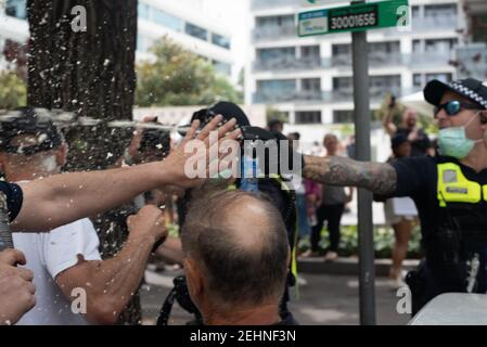 Melbourne, Australia. 20th Feb 2021. Police use capsicum spray against non-complient anti COVID vaccination protesters. February 20, 2021. Melbourne, Australia. Credit: Jay Kogler/Alamy Live News Stock Photo