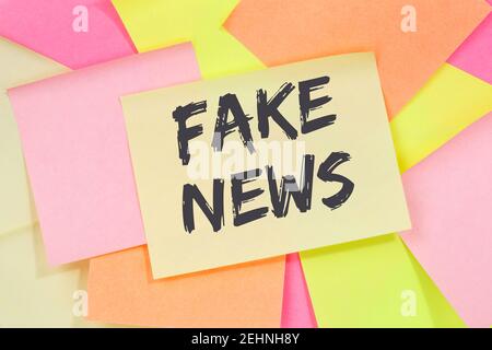 Fake news truth lie media internet online business concept note paper notepaper Stock Photo