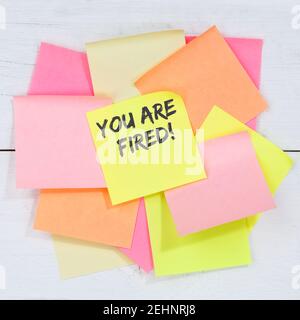 You are fired employee losing jobs, job working unemployed business concept desk note paper notepaper Stock Photo