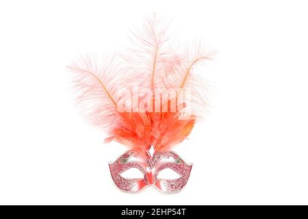 Carnival mask with pink feathers isolated on a white background. Stock Photo