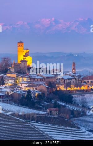 Blue hour on the medieval town of Serralunga d'Alba and its castle viewed from the surrounding vineyards. Serralunga d'Alba, Langhe, Piedmont, Italy, Stock Photo