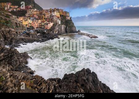 The small village of Manarola at sunset after a storm. Cinque Terre, La Spezia district, Liguria, Italy. Stock Photo