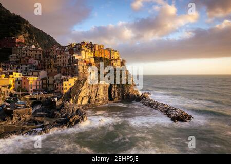 The small village of Manarola at sunset after a storm. Cinque Terre, La Spezia district, Liguria, Italy. Stock Photo