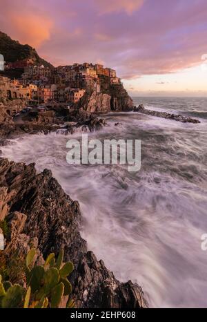 The small village of Manarola at sunset after a storm. Cinque Terre, La Spezia district, Liguria, Italy. Stock Photo