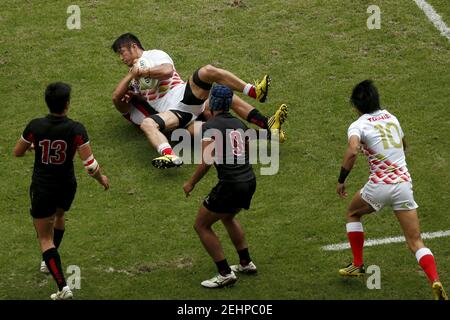 Japan S Oshima Satoshi Is Tackled By Singapore S Muhammad Azmi Bin Suliman During Their Asia Rugbya S Sevens Qualifying Tournament For The 16 Rio Olympics In Hong Kong November 7 15 Reuters Tyrone Siu Stock