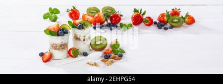 Strawberry yogurt fruit breakfast spoon healthy eating yoghurt food on a wooden board banner copyspace copy space Stock Photo
