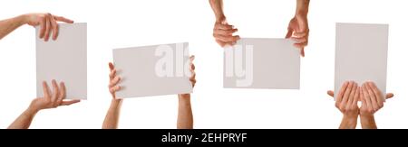 Set of four A4 posters holding with both hands with white isolated background Stock Photo