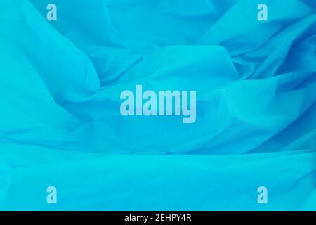 Crumpled blue crepe paper texture as a background. Stock Photo