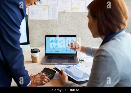 Business people anazyling sales Stock Photo