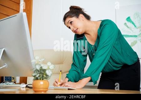 Female entrepreneur talking on phone Stock Photo