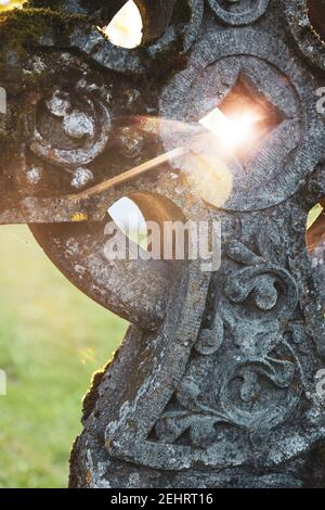 Ornate old celtic cross burial stone. Stock Photo