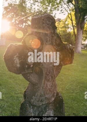 Ornate old celtic cross burial stone. Stock Photo
