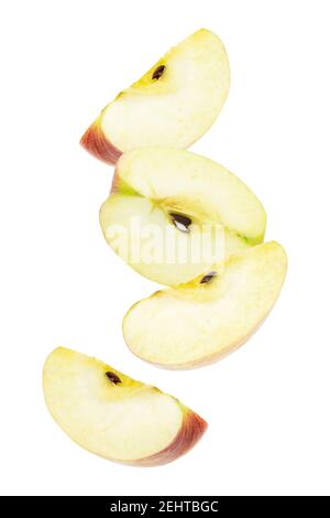 Falling pieces of ripe apples fruit isolated on white background Stock Photo