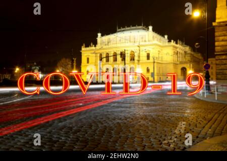 Coronavirus in Prague, Czech Republic.The building of Rudolfiunum concert halls on Jan Palach Square. Covid-19 sign on a blurred background. Concept o Stock Photo