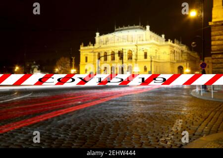 Coronavirus in Prague, Czech Republic.The building of Rudolfiunum concert halls on Jan Palach Square. Covid-19 sign on a blurred background. Concept o Stock Photo