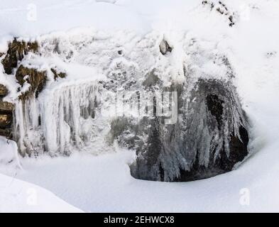 A frozen waterfall on a stream / syke in the North Pennines, Weardale, County Durham Stock Photo