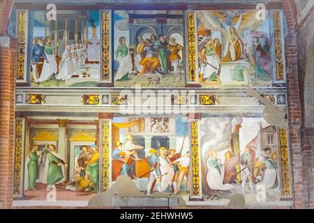 The San Teodoro Fresco in Basilica of San Teodoro in Pavia, Lombardy, Italy. The fresco tells the story in twelve tableaux of the bishop of Pavia, Teo Stock Photo