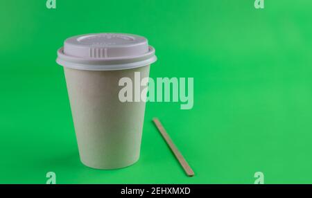 recyclable disposable cardboard cup with green background Stock Photo