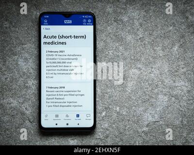 The UK's NHS smartphone app shows evidence of an Oxford  AstraZeneca COVID vaccination given given on 2nd February 2021. Stock Photo