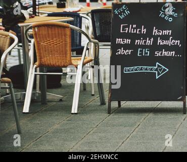 Sign on the street that said Luck can not be bought but an ice cream can, in german language Stock Photo