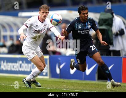 Coventry City's Sam McCallum (right) and Brentford's Mads Roerslev battle for the ball during the Sky Bet Championship match at St. Andrew's Trillion Trophy Stadium, Birmingham. Picture date: Saturday February 20, 2021. Stock Photo