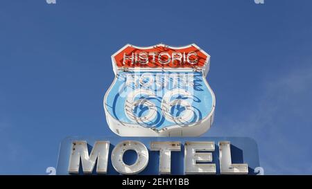 Motel retro sign on historic route 66 famous travel destination, vintage symbol of road trip in USA. Iconic lodging signboard in Arizona desert. Old-f Stock Photo